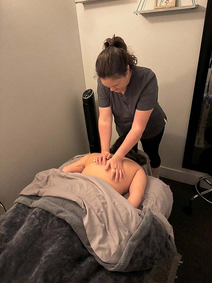 Chiropractic Redondo Beach CA Christina Massage A person receiving a back massage.